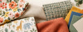 Fabric swatches and folded fabrics — order a 5 inch by 5 inch swatch to check color, texture and drape before buying yardage