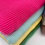 Waved urban rib knit fabric by the yard - fuchsia, aqua and yellow wavy rib knit close-up