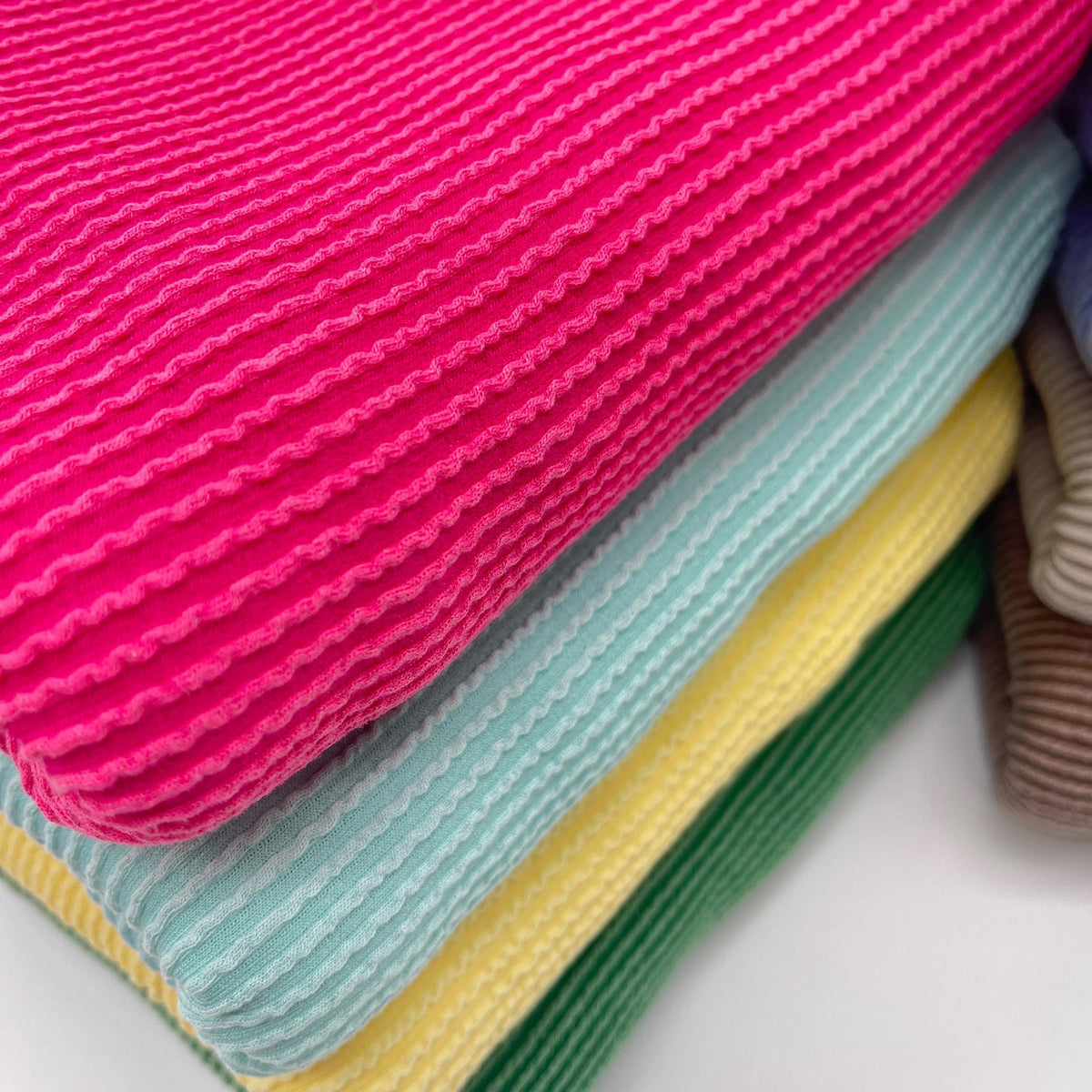 Waved urban rib knit fabric by the yard - fuchsia, aqua and yellow wavy rib knit close-up