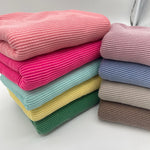 Waved urban rib knit fabric by the yard - full colorway collection folded stacks