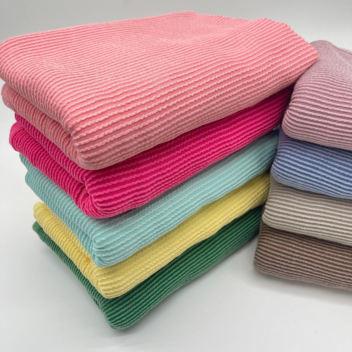 Waved urban rib knit fabric by the yard - all available solid colors stacked