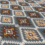 Southwestern aztec tapestry fabric close-up texture detail
