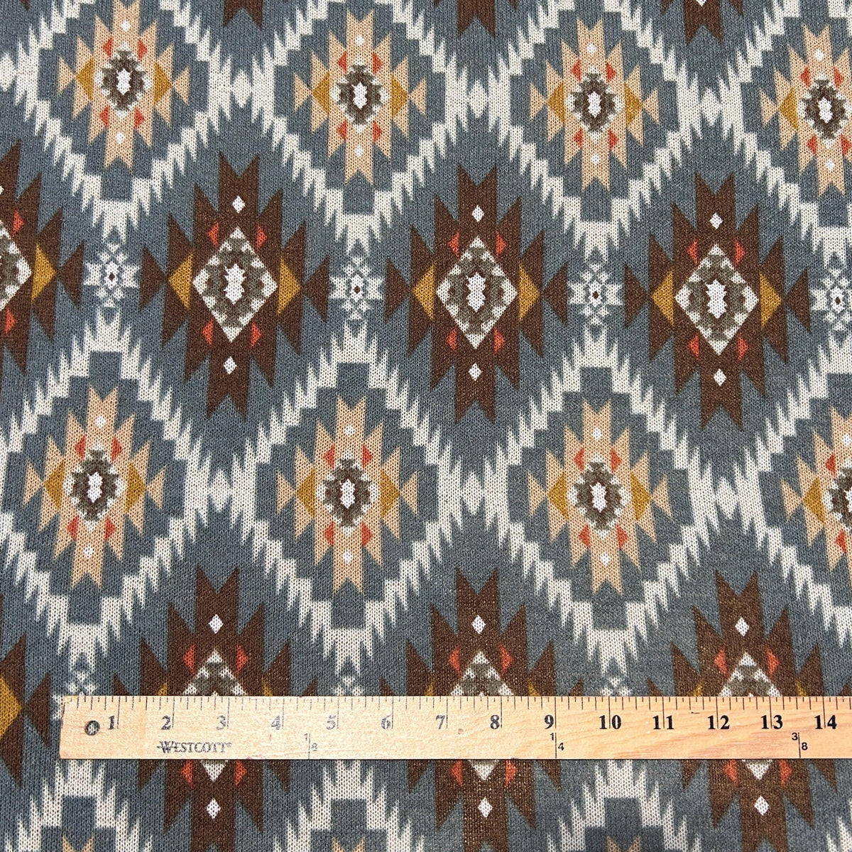 Southwestern aztec tapestry fabric flat lay view