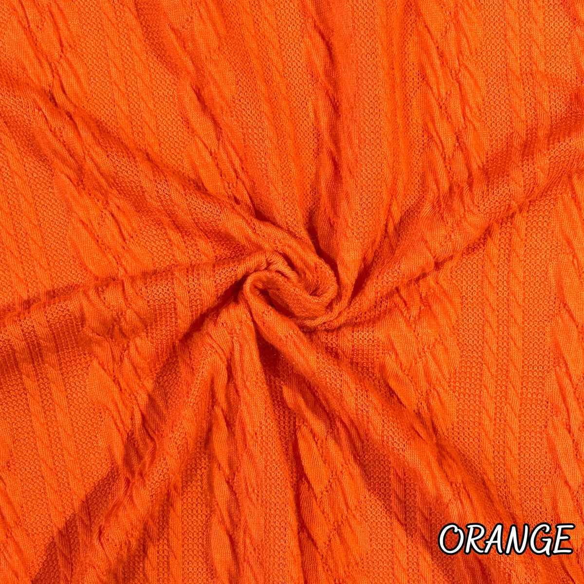 Twisted cable knit fabric draped view