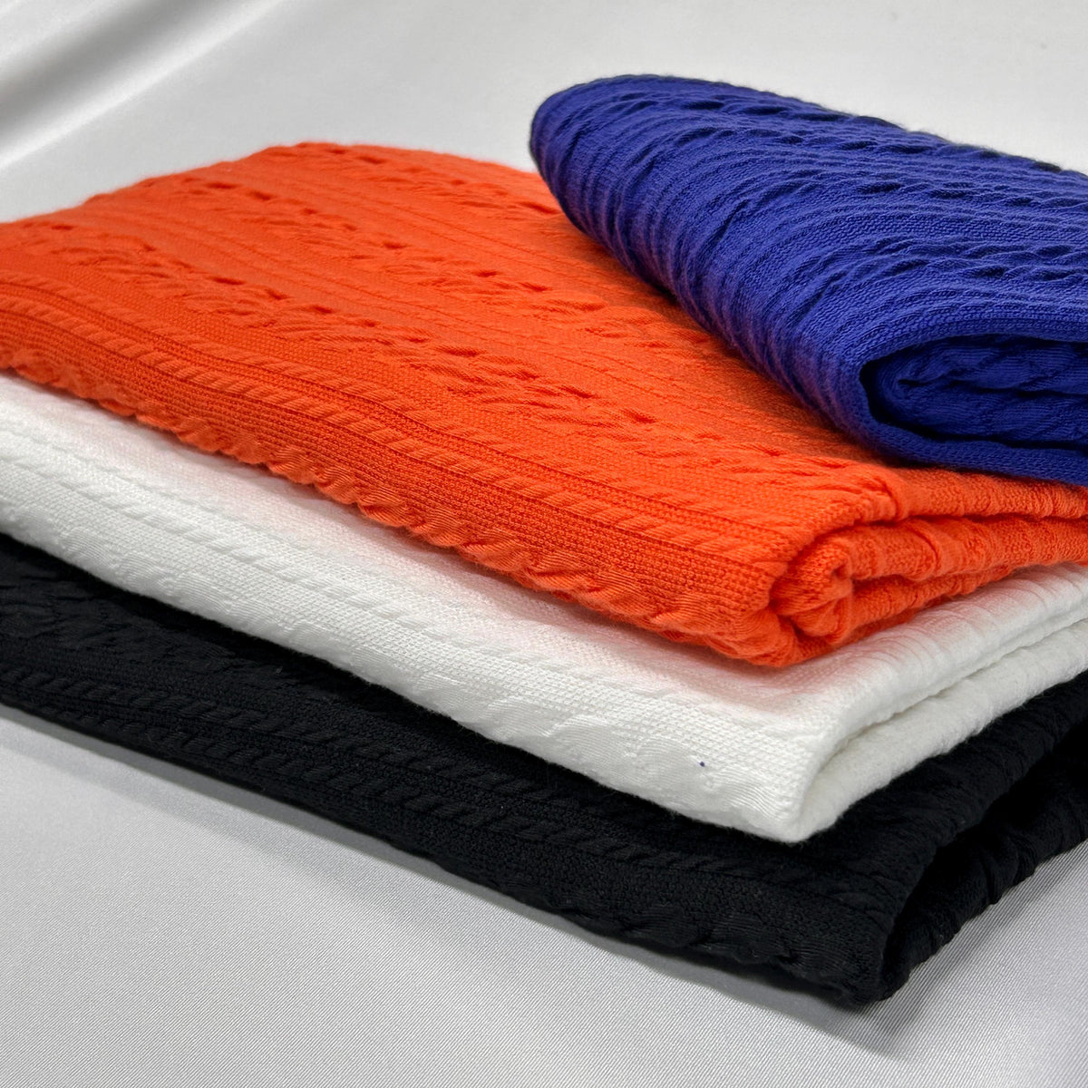 Twisted cable knit fabric flat lay view