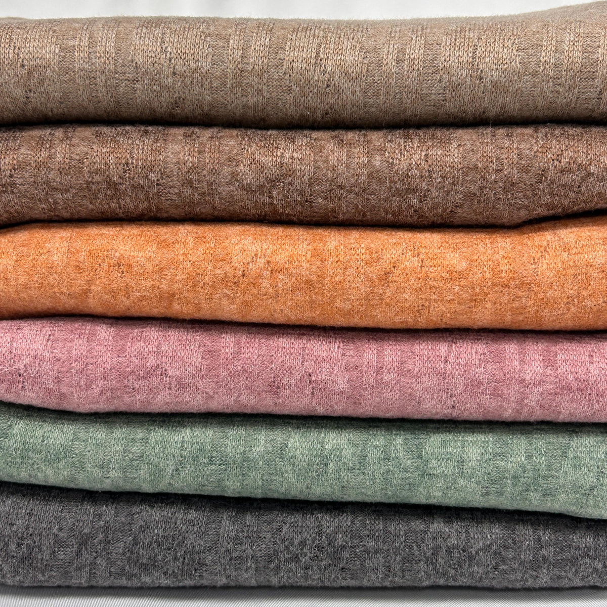 Brown cable twist knit fabric close-up texture detail