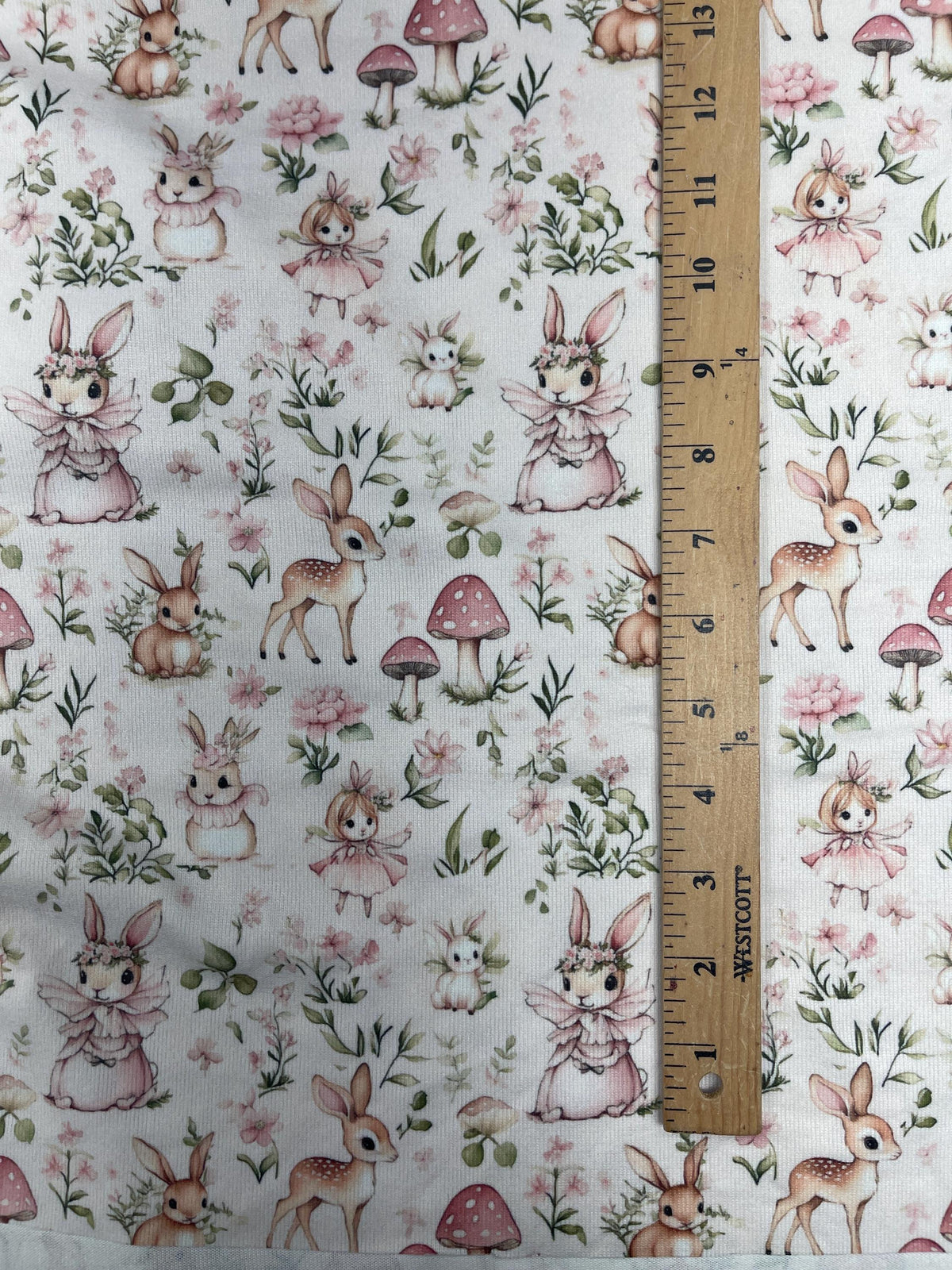 Whimsical woodland fairy tale fabric flat lay view