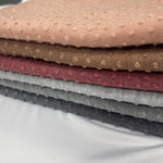 Swiss dot jacquard knit fabric flat lay view