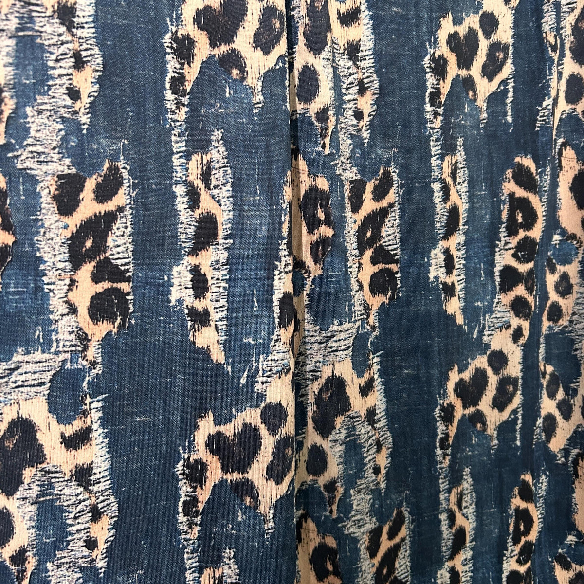 Animal mix denim print fabric close-up texture detail