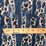Animal mix denim print fabric flat lay view