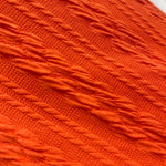 Twisted cable knit fabric close-up texture detail