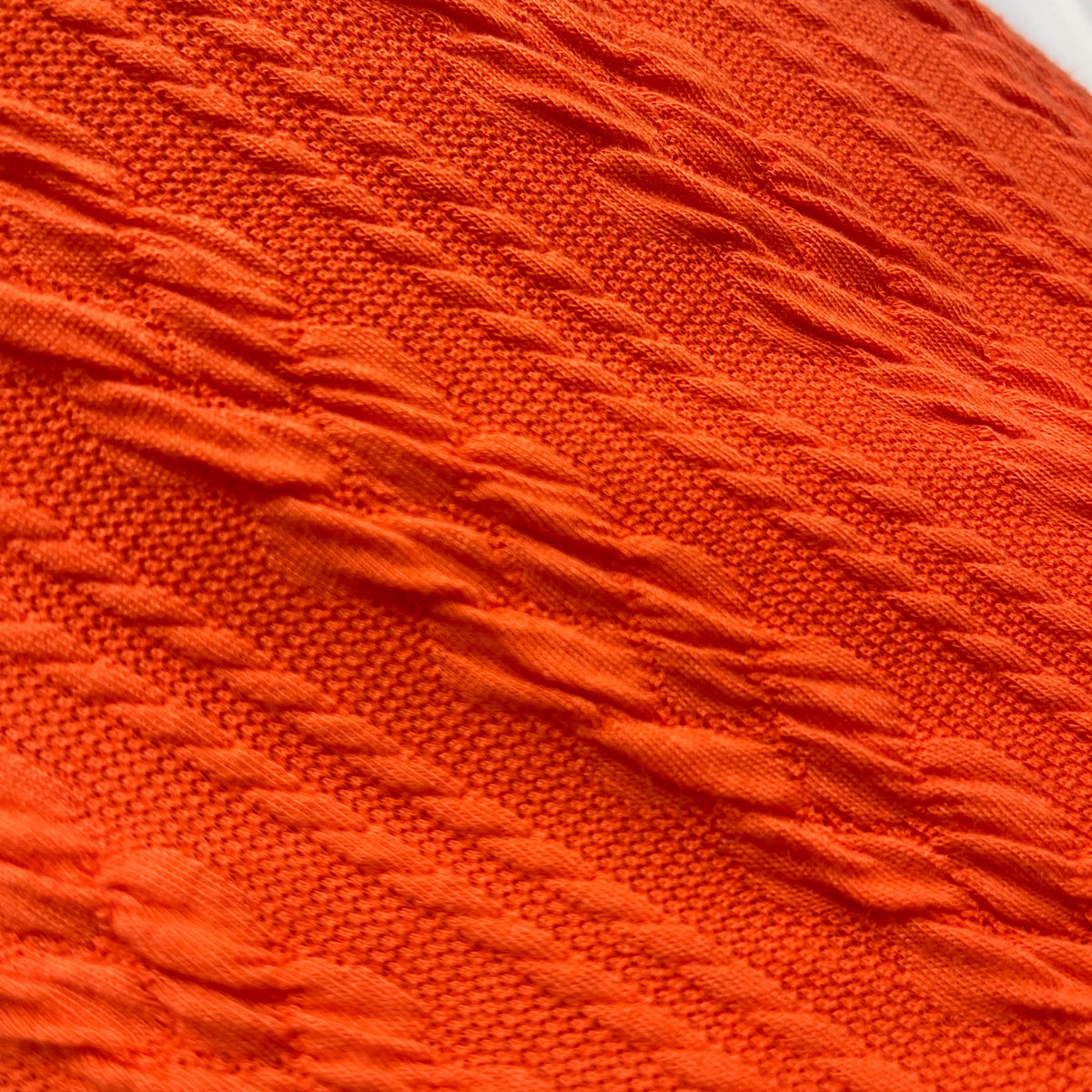 Twisted cable knit fabric close-up texture detail