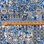Blue majolica sicilian tile fabric flat lay view