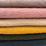 Poodle teddy faux fur fabric close-up texture detail