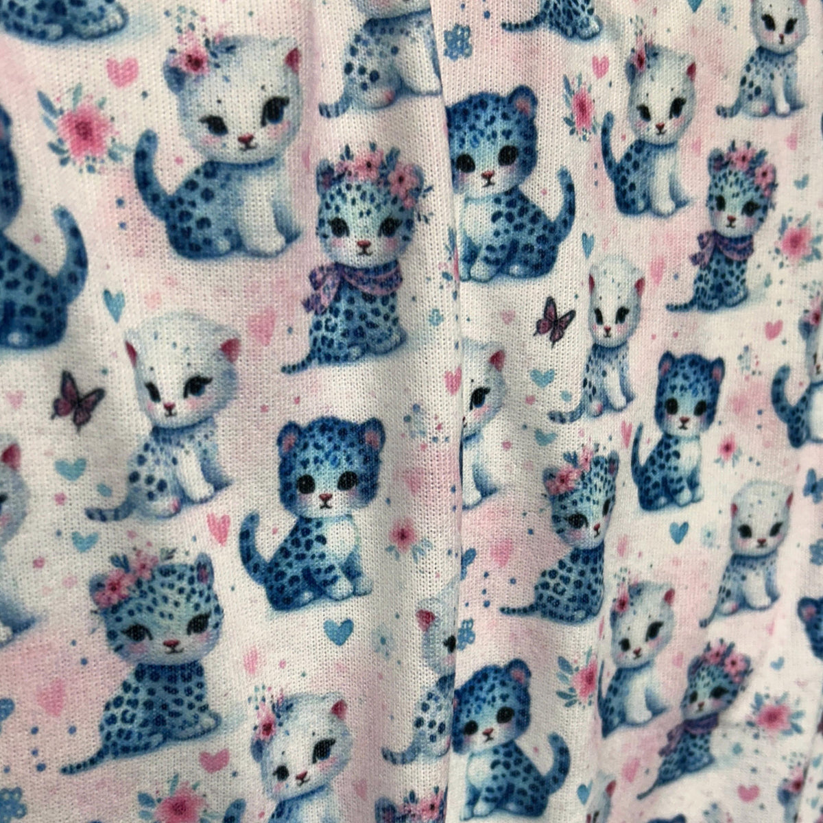 Baby leopard nursery fabric close-up texture detail
