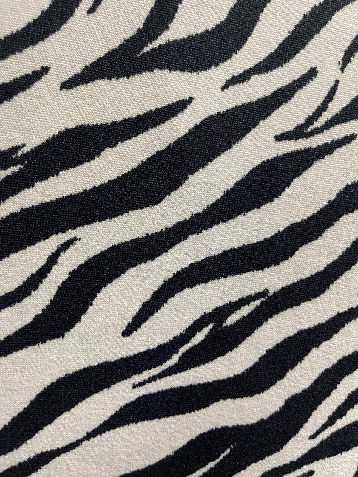 Black and white zebra print fabric close-up texture detail