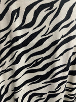 Black and white zebra print fabric draped view