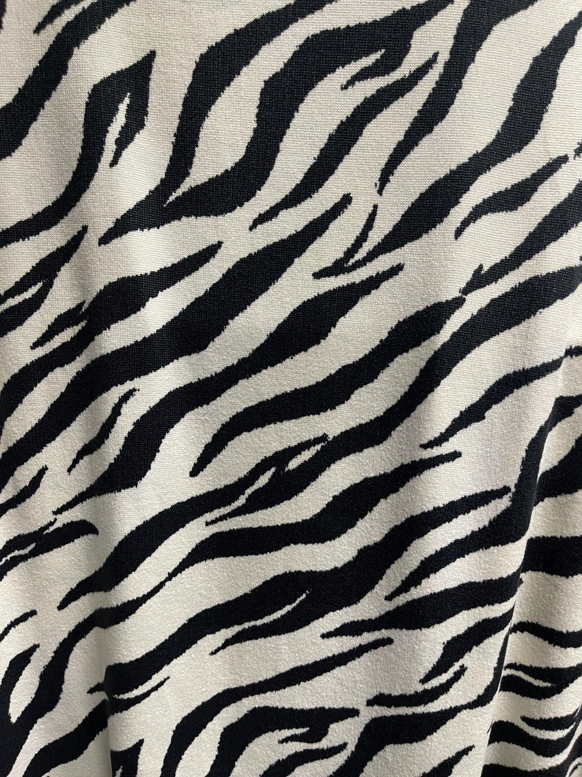 Black and white zebra print fabric draped view