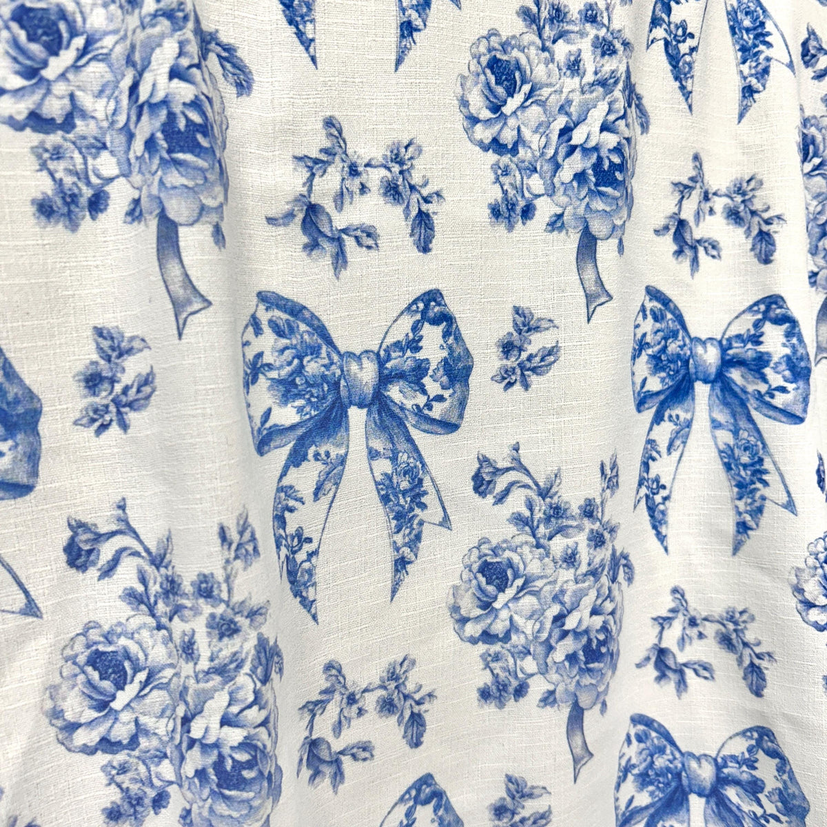 French blue ribbon toile fabric folded view