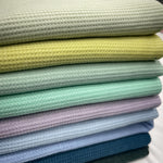 Soft brushed waffle knit fabric close-up texture detail