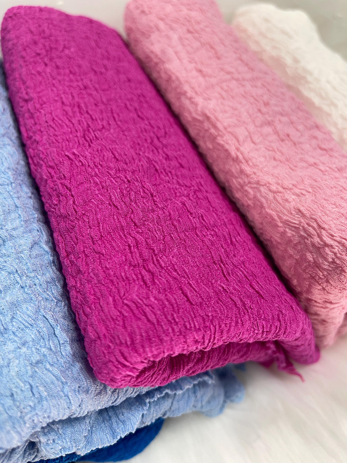Wrinkled jacquard crepe fabric close-up texture detail