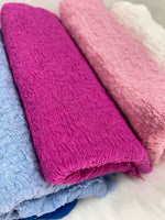 Wrinkled jacquard crepe fabric close-up texture detail