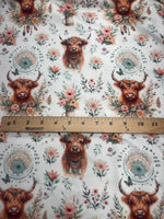 Boho highland cow floral fabric close-up texture detail