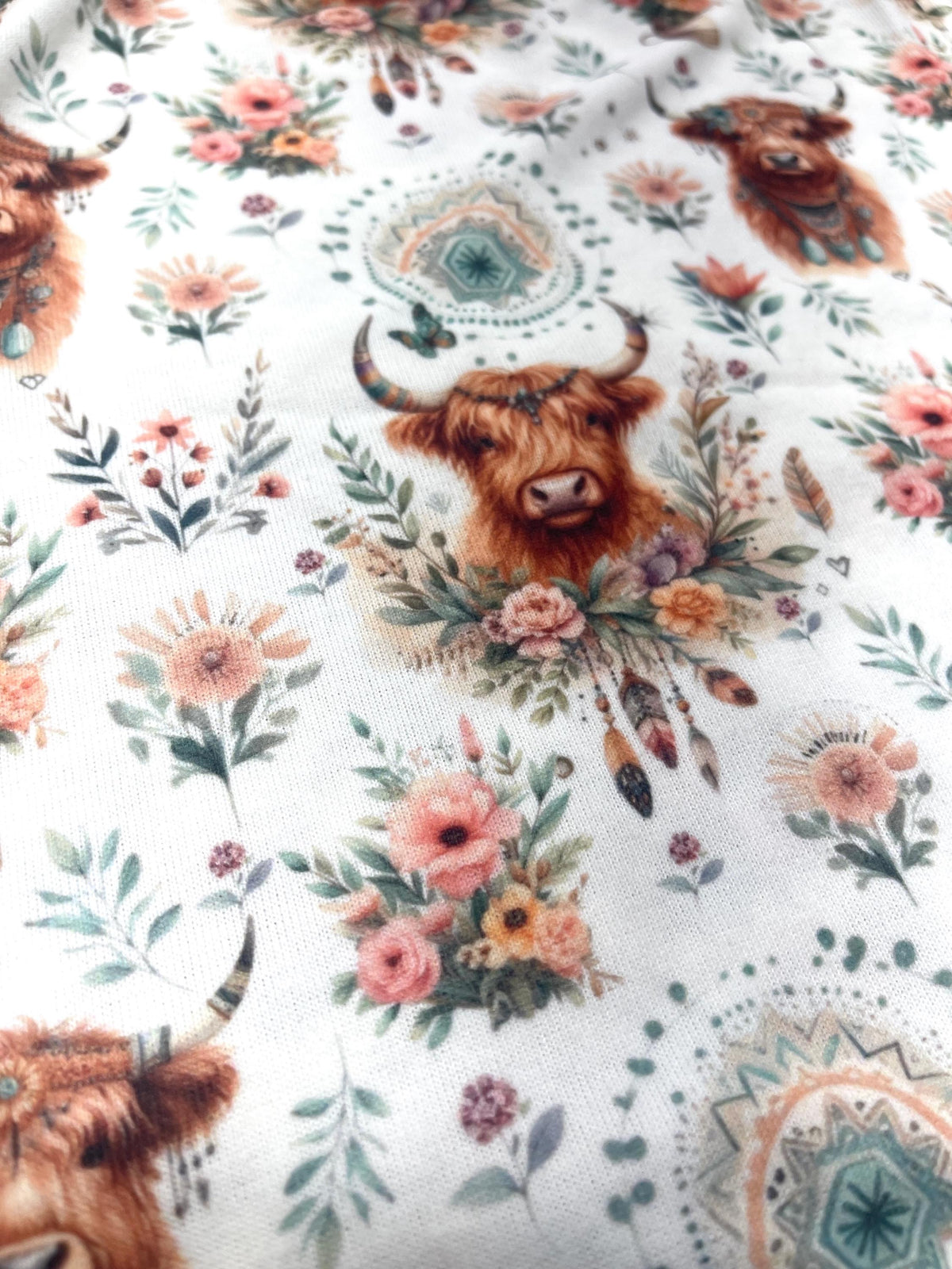 Boho highland cow floral fabric folded view