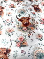 Boho highland cow floral fabric folded view