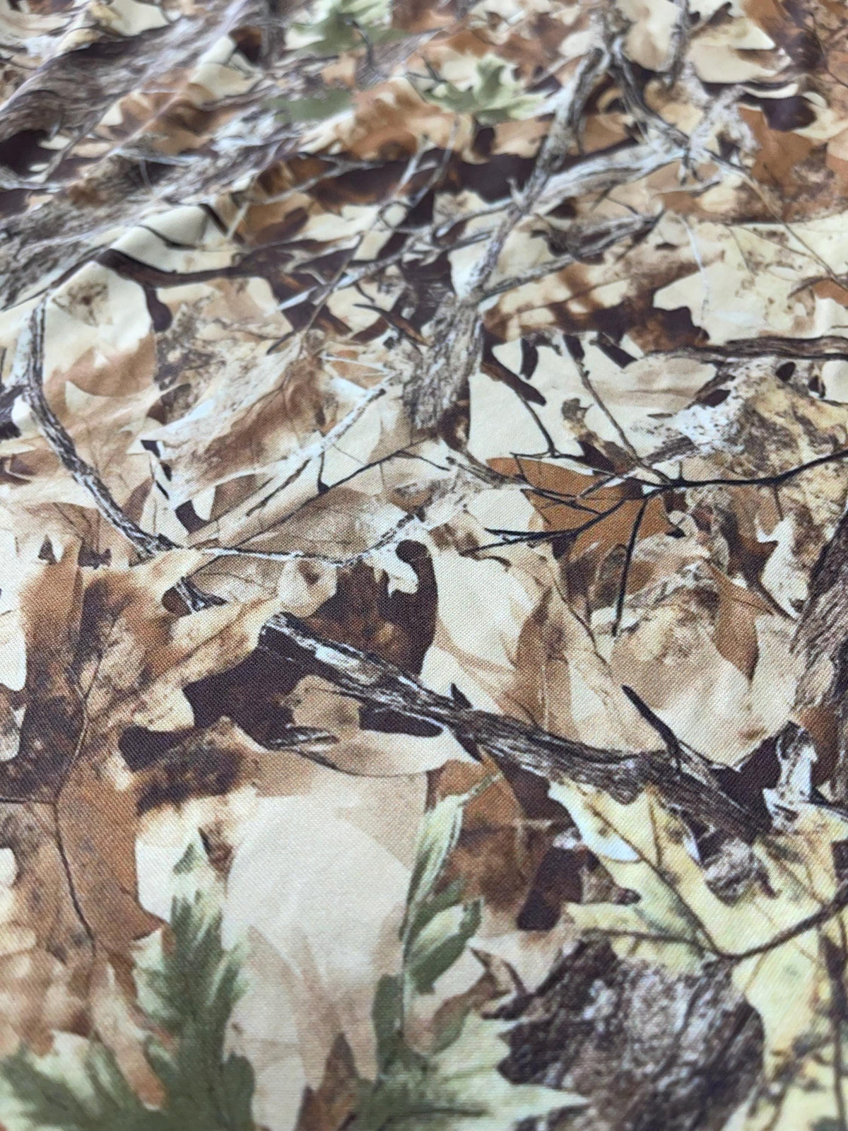 Tree bark camouflage fabric draped view