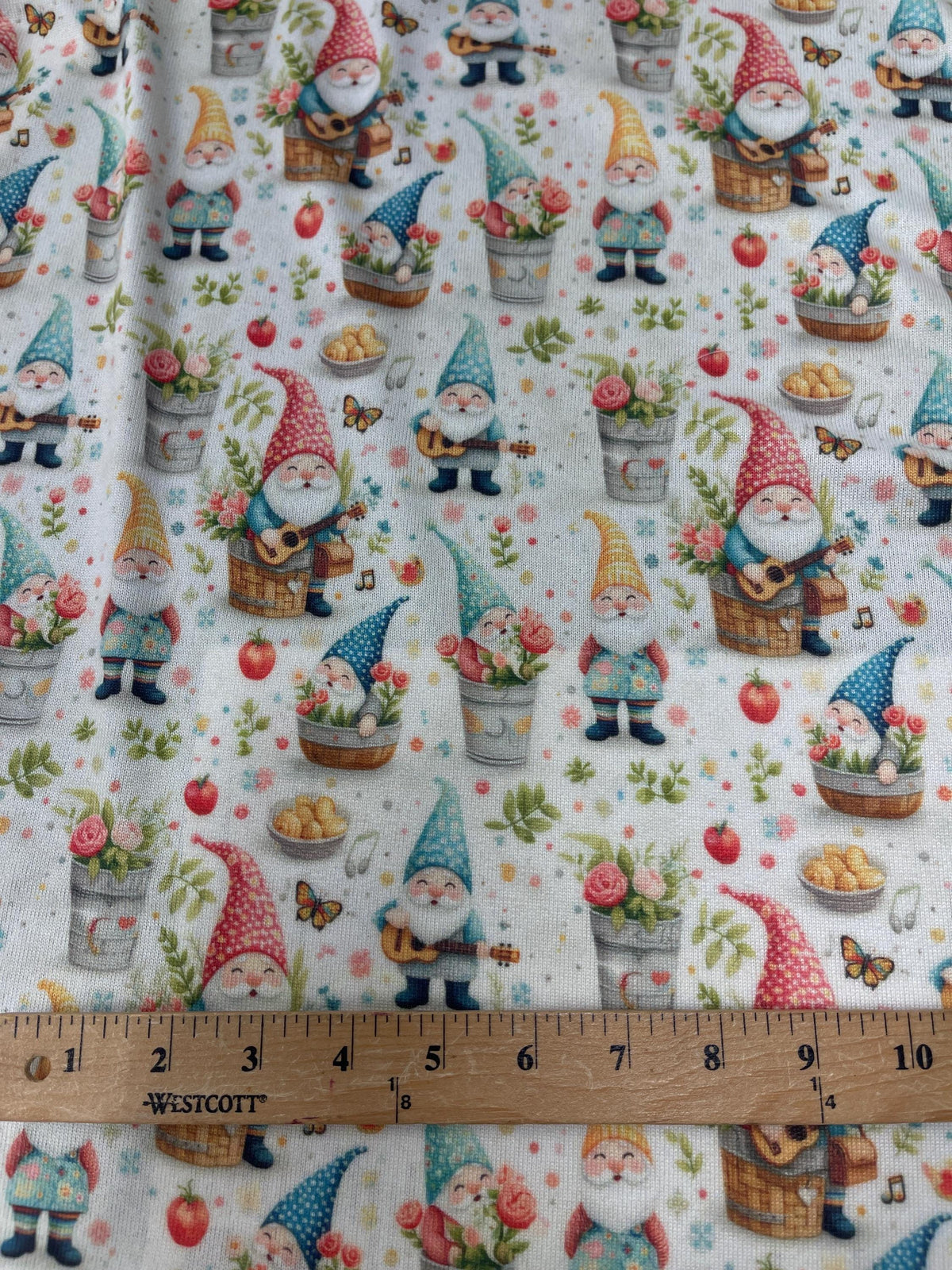Whimsical gnome garden fabric detail view