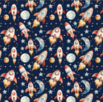 Outer space rocket galaxy nursery fabric flat lay view