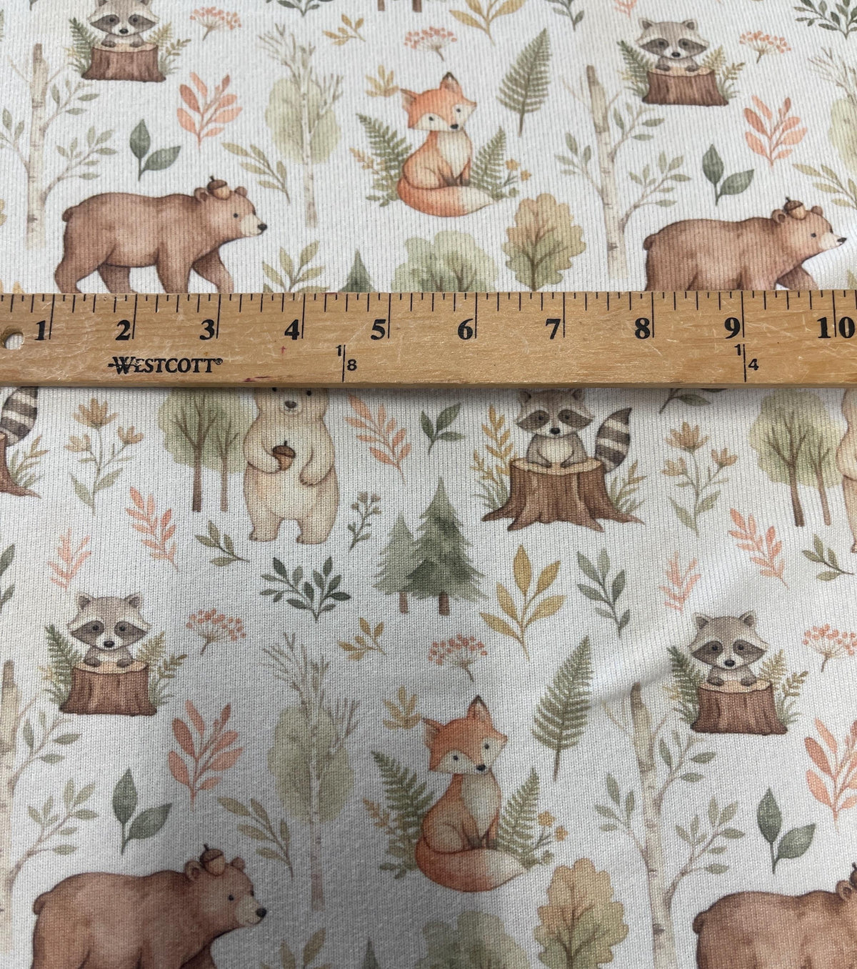 Autumn forest animals nursery fabric close-up texture detail