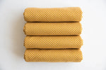 Mustard Polka Dot Cotton — Folded stack view