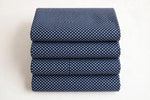 Navy Polka Dot Cotton — Folded stack view