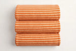Orange Stripe Knit — Folded stack view