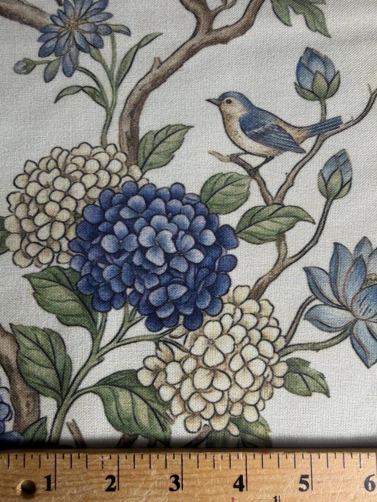 Blue Bird Botanical fabric close-up with ruler for scale