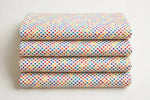 Rainbow Polka Dot Cotton — Folded stack view