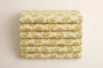 Yellow Floral Cotton — Folded stack view